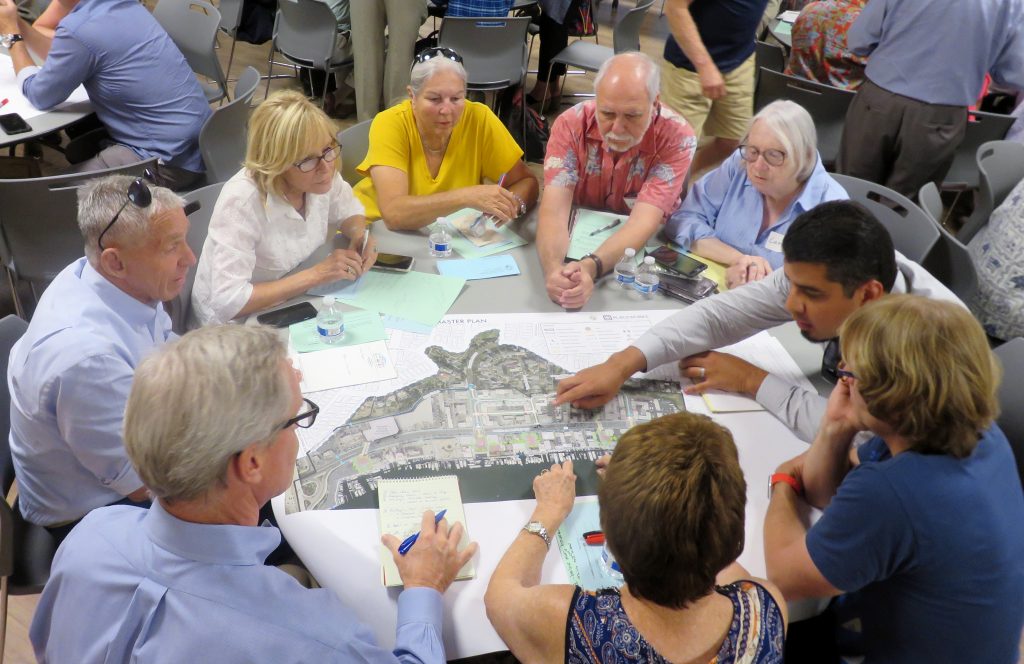 Jaime Murillo, a Newport Beach city senior planner, discusses the Mariners’ Mile Revitalization Master Plan with members of the public during a special Planning Commission meeting and community workshop on Monday. — Photo by Sara Hall ©