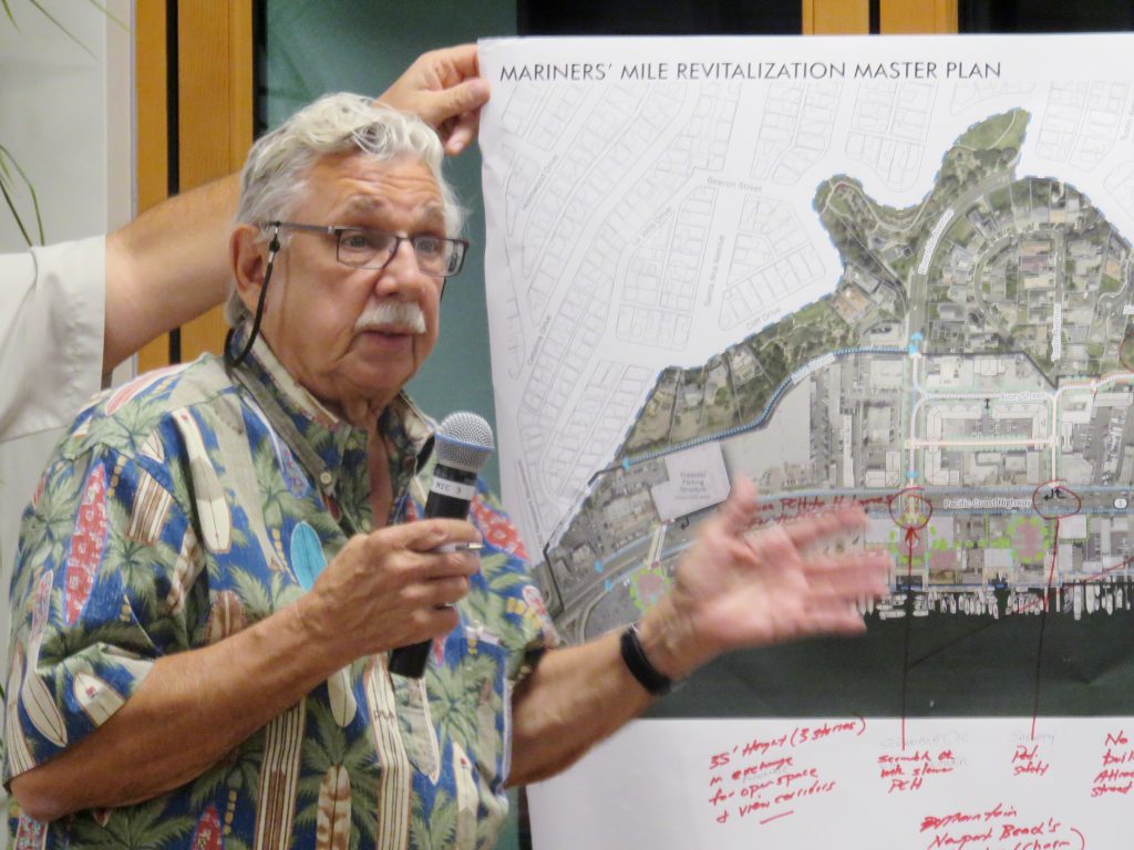 A member of the public talks about his group’s ideas for the Mariners’ Mile Revitalization Master Plan with in front of a map of the area during the meeting Monday. — Photo by Sara Hall ©