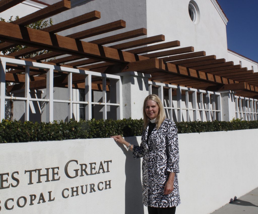 The Rev. Canon Cindy Evans Voorhees in front of the shuttered St. James the Great Episcopal Church — NB Indy file photo ©