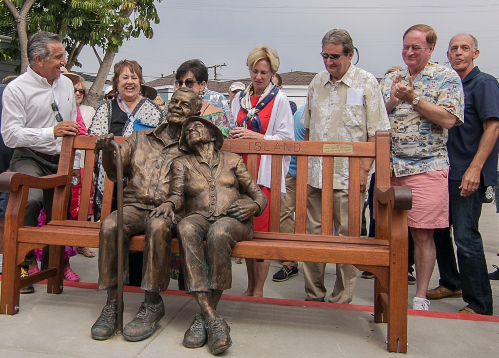 (left to right) Councilman Tony Petros, sculptors Rhonda Jones and Miriam Baker, Mayor Diane Dixon, Councilmen Ed Selich and Keith Curry, and Balboa Island Improvement Association President Lee Pearl at the unveiling of the “Sunset Years” sculpture on Balboa Island. — Photo by Jim Collins ©