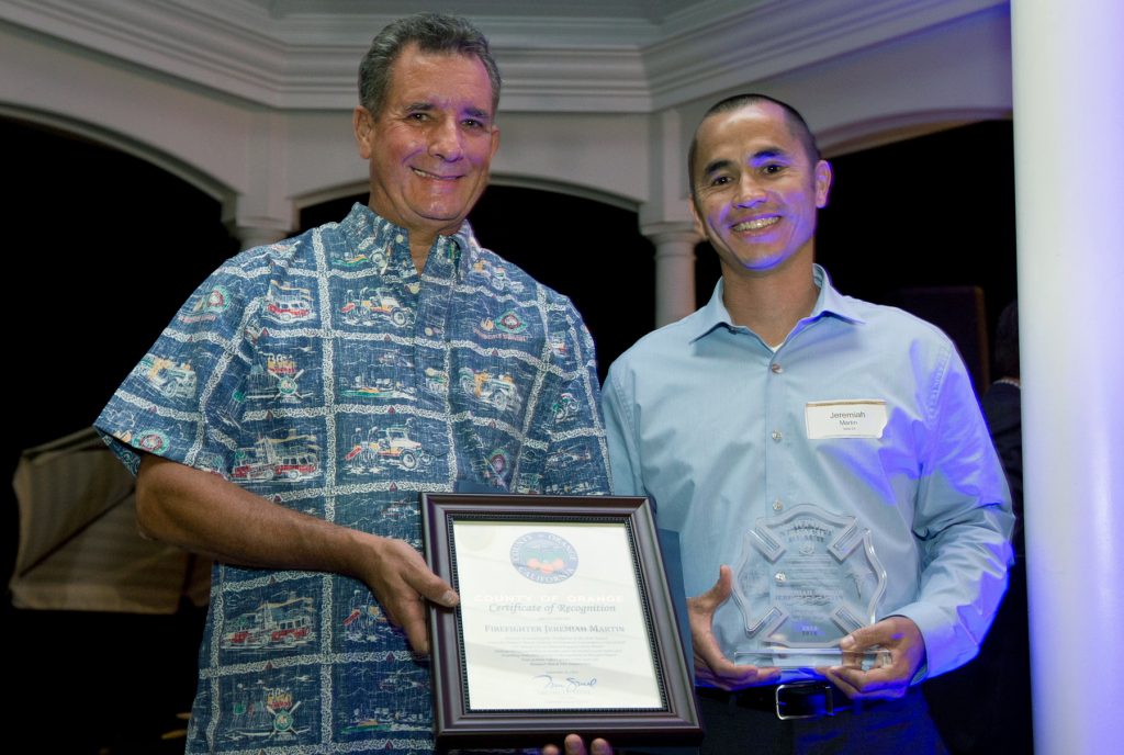 Chief Scott Poster (left) and Firefighter of the Year Jeremiah Martin pose for a photo at the Fire and Lifeguard Appreciation Dinner last week, hosted by the Commodores Club of the Newport Chamber of Commerce. — NB Indy file photo © 