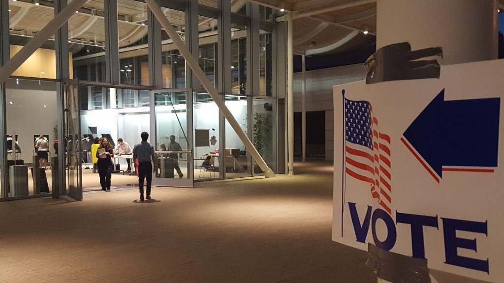 Newport Beach residents head into the community room at the Civic Center Tuesday to cast their vote. — Photo by Christopher Trela ©