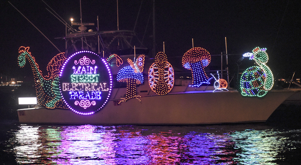 Millions watched the 108th Annual Newport Beach Christmas Boat Parade in Newport Harbor between Dec. 14-18, which included a boat from Grand Marshal Mickey Mouse’s team called the Disneyland Main Street Electrical Parade boat. — Photo by Lawrence Sherwin ©