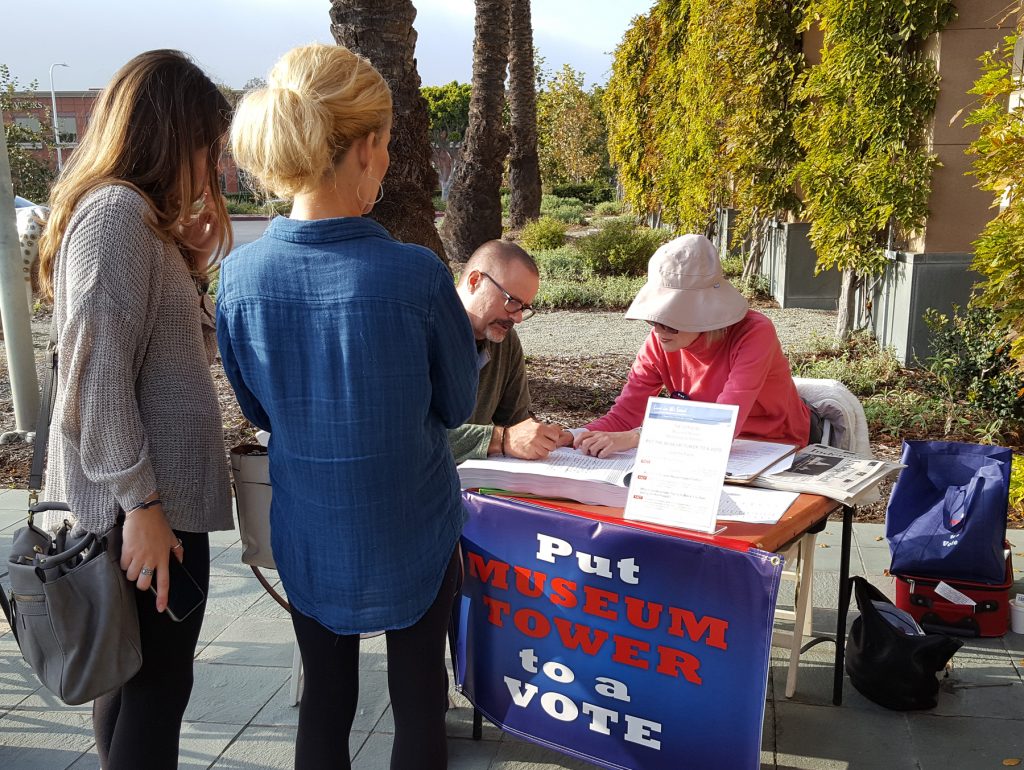 Residents line up in front of the Newport Beach Public Library to sign the Line in the Sand petition against Museum House. — NB Indy file photo ©