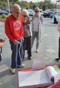 Residents line up in front of the Newport Beach Public Library to sign the Line in the Sand petition against Museum House. 