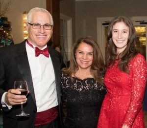 UCI MIND Co-Director, Dr. Frank LaFerla toasts UCI MIND Leadership Council member, Dr. Jacqueline DuPont and his daughter, Monica LaFerla.