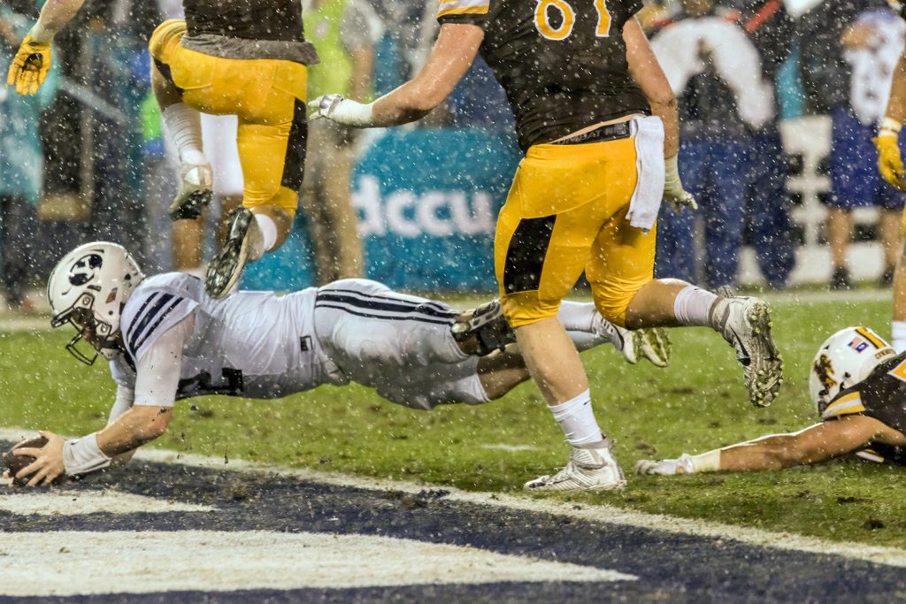 BYU Quarterback Tanner Mangum dives into end zone for the first score of the game