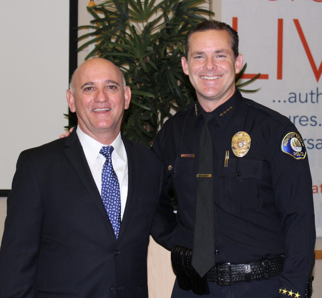 Chamber of Commerce President Steve Rosansky and Chief of Police Jon Lewis pose for a photo at the Chamber's monthly Wake Up! Newport meeting on Thursday. — Photo by Victoria Kertz ©