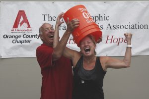 Ralph Rodheim helps Arts Commissioner Lyn Selich take the Ice Bucket Challenge in August 2014 