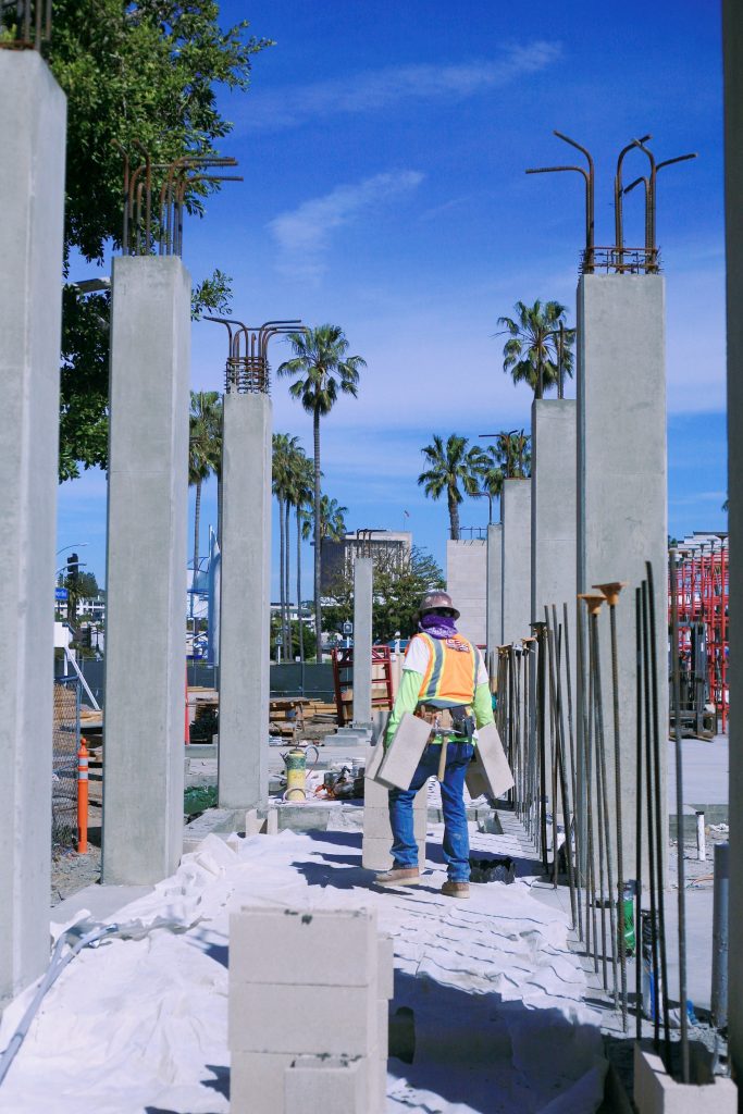 A builder works on the Lido House Hotel. — Photo by Sara Hall ©