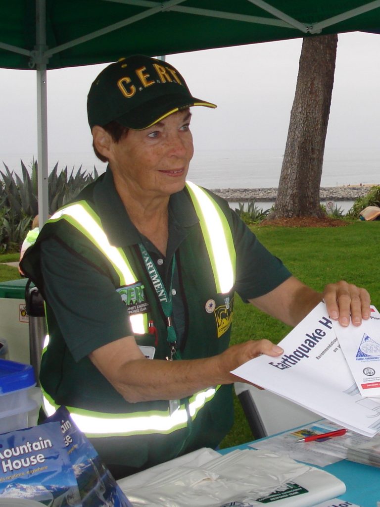 Marilyn Broughton helps residents at a Community Emergency Response Team event. — Photo courtesy Newport Beach Fire Department ©