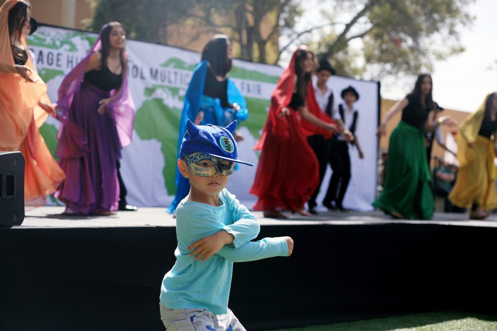 Robert Luo, 4, dances along with Sage Hill students and Persian dancers Sahar Rohani, Sahar Emtiaz, Ava Kahn, Sarah Takallou, Arianna Dominic, Kianna Dominic, Ava Emami, Pirooz Pezeshpour, Arman Ramezani, Sallar Tahbaz, Iman Amini, Arya Aydin and Ryan Hosseinzadeh. — Photo by Sara Hall ©