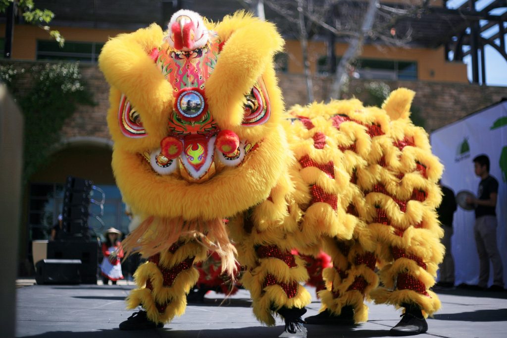 Ane Thanh’s Chinese Lion Dancers perform on stage at the 16th Annual Sage Hill School Multicultural Fair on Saturday. — Photo by Sara Hall ©