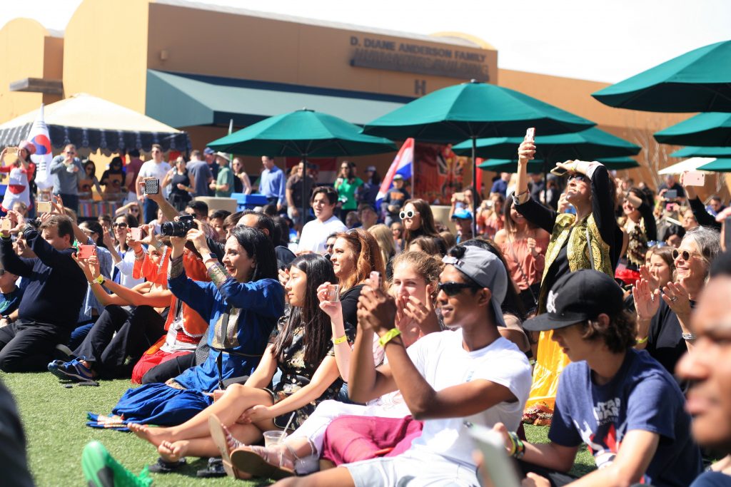 Students, staff, friends and family take photos of the popular Sage Hill student Persian dancers.   — Photo by Sara Hall ©