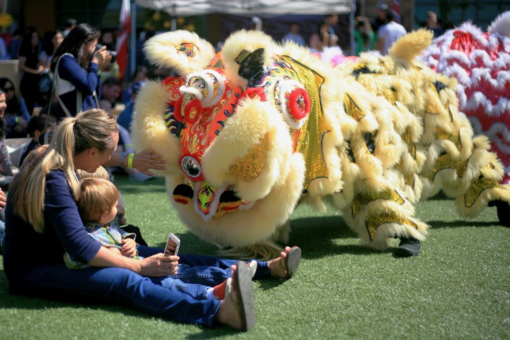 Members of Ane Thanh’s Chinese Lion Dancers interact with the crowd at the 16th Annual Sage Hill School Multicultural Fair on Saturday. — Photo by Sara Hall ©