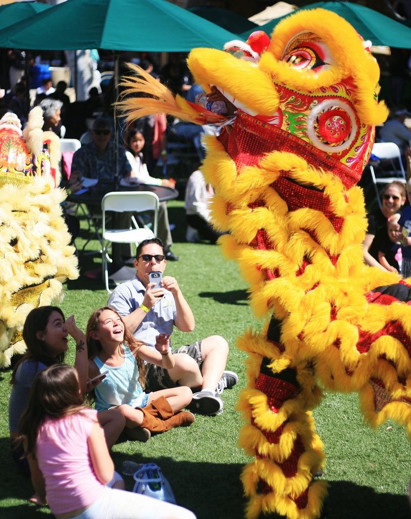 Members of Ane Thanh’s Chinese Lion Dancers interact with the crowd at the 16th Annual Sage Hill School Multicultural Fair on Saturday. — Photo by Sara Hall ©