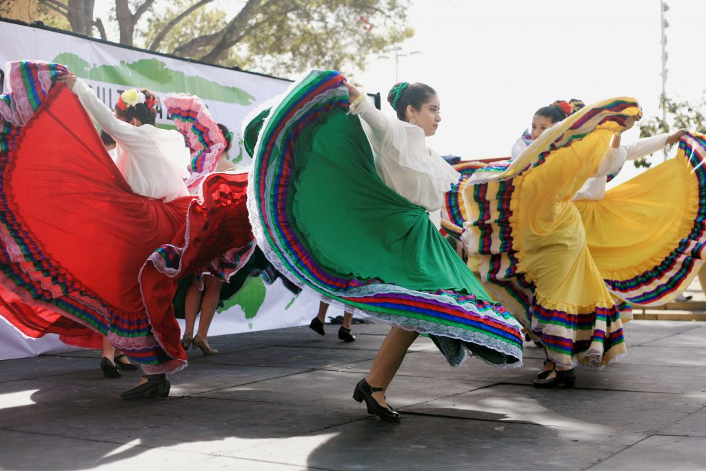 Sage Hill students Andrea Flores, Joyce Jogwe, Mitzi Arizmendi, Ariel Gutierrez, Kristen Palacio, Ashley Ramirez, Christina Acevedo and Krystal Gallegos perform ballet folklorica at Saturday’s Multicultural Fair. — Photo by Sara Hall ©