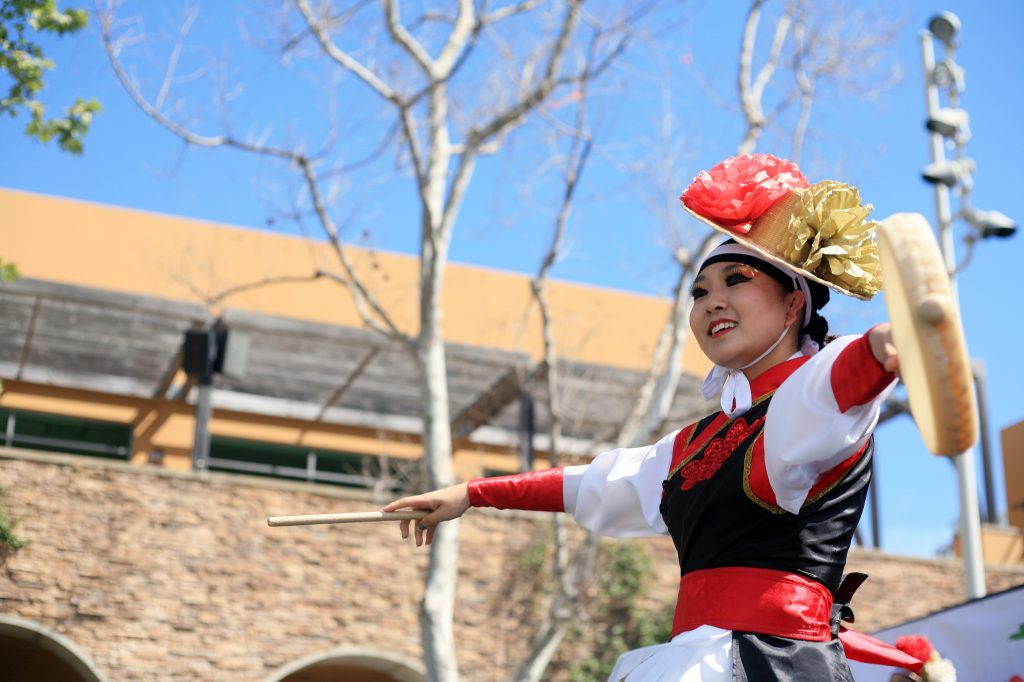 A KAYPA member performs a Korean traditional drum dance at the Multicultural Fair. — Photo by Sara Hall ©