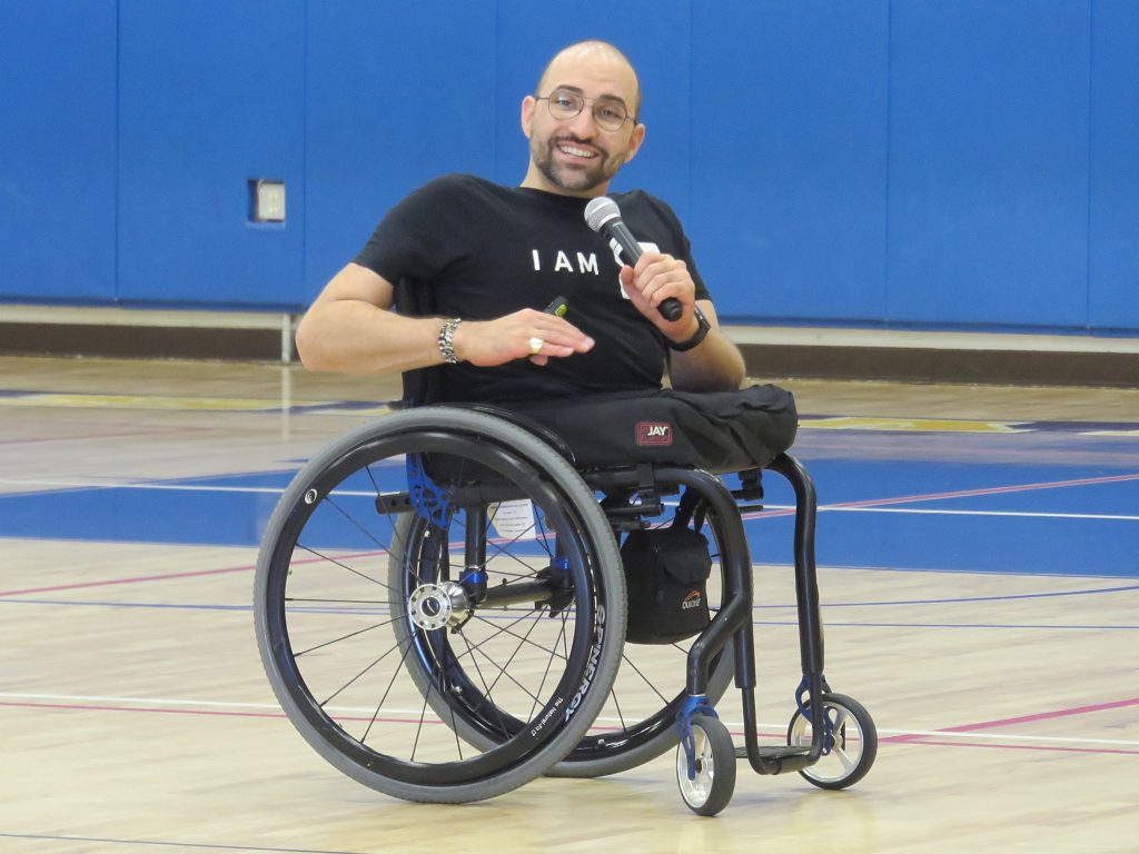 Author and motivational speaker Spencer West speaks to Harbor Day School students, staff and parents on March 8 about tackling challenges and working together to make the world  a better place.  — Photo by Sara Hall ©