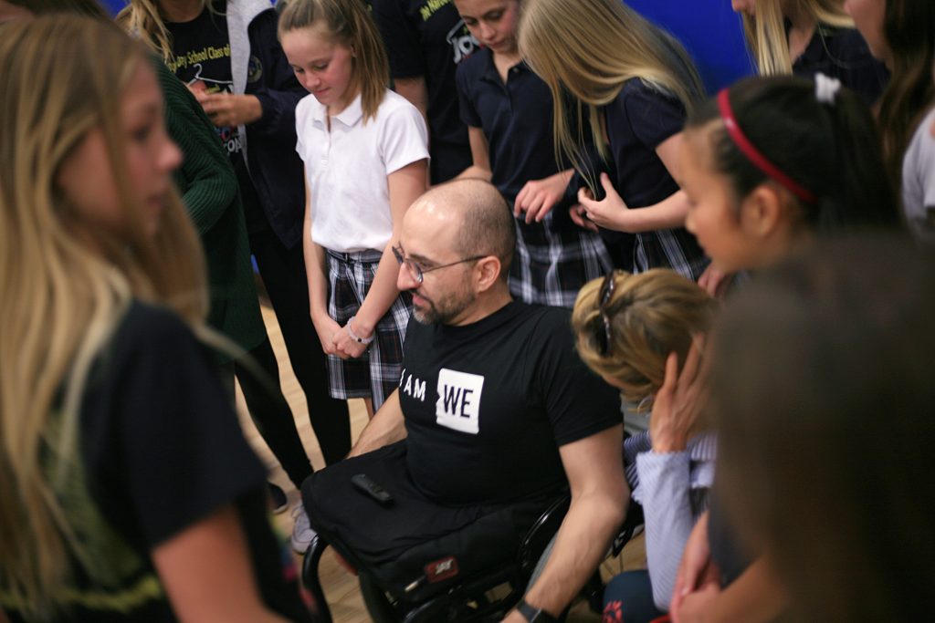 Author and motivational speaker Spencer West speaks to HDS students after the event. — Photo by Sara Hall ©