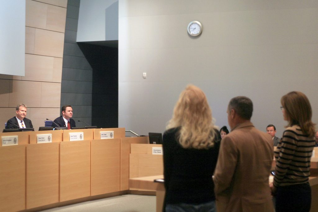 Residents (foreground, left to right) Lori Morris, Paul Blank and Lynn Swain present their case for a recall of Councilman Scott Peotter (background, left) at the meeting Tuesday. — Photo by Sara Hall ©