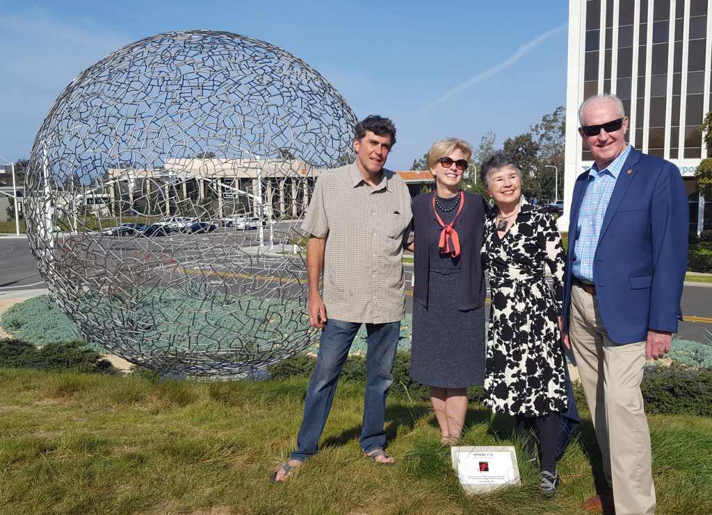 (left to right) Artist Ivan McLean, Newport Beach City Councilwoman Diane Dixon, NB Arts Foundation President Carmen Smith, and City Councilman Jeff Herdman pose for a photo in front of the Sphere 112 at the dedication ceremony on Tuesday. — Photo by Christopher Trela ©