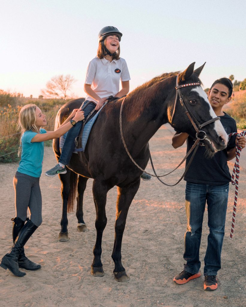 Kids enjoy riding a horse at the Back Bay Therapeutic Riding Club. — Photo courtesy BBTRC ©