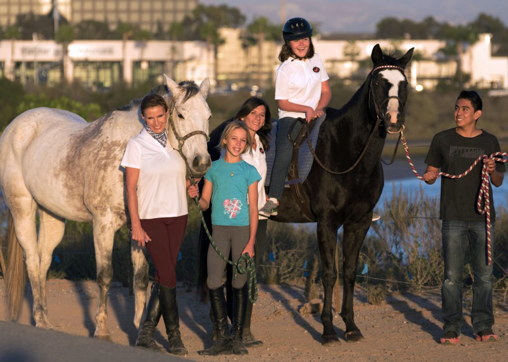 Bernadette Olsen (far left) and members of the Back Bay Therapeutic Riding Club. — Photo courtesy BBTRC ©