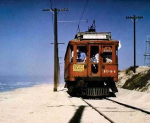 An old Red Car trolley making its way along the coast