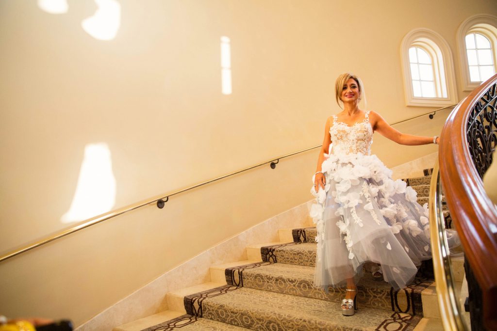 Leila Rasouli MD of Newport Coast, a Saddleback Memorial Foundation Board Member and Bronze Sponsor, descends the staircase to enter the gala.