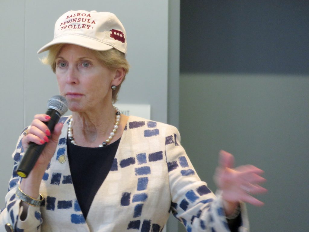Newport Beach Councilwoman Diane Dixon talking at the Speak Up Newport meeting on Wednesday while wearing a Balboa Peninsula Trolley hat. — Photo by Sara Hall ©