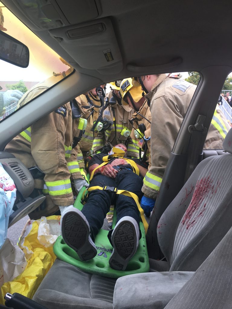 A student participant is removed from a vehicle during the “Every 15 Minutes” simulated crash on Wednesday.  — Photo courtesy of Newport Beach Fire Department ©