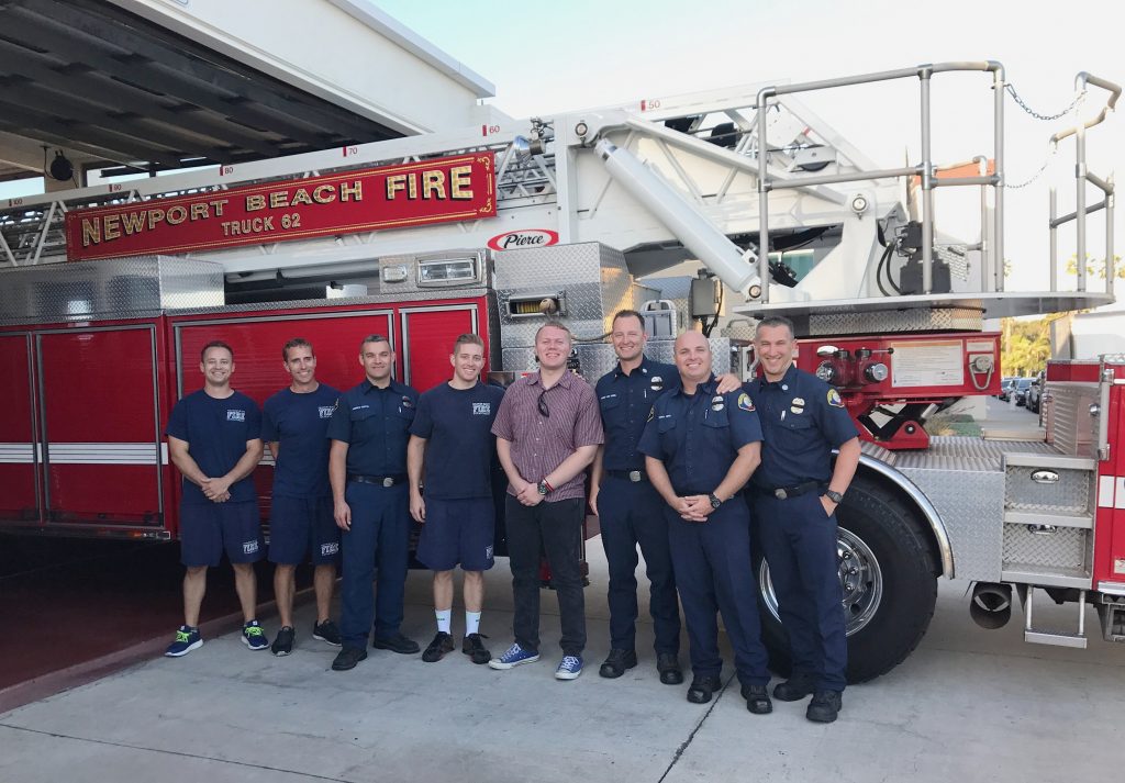 Dominic Laffoon, 18, stands with members of the Newport Beach Fire Department during his Make-A-Wish wish reveal recently at the Lido Isle station. — Photo courtesy Make-A-Wish Orange County and the Inland Empire ©