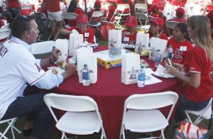 Former Angels star pitcher Chuck Finley of Newport Beach (left) talks to second grade students during the “Readers in the Outfield” event