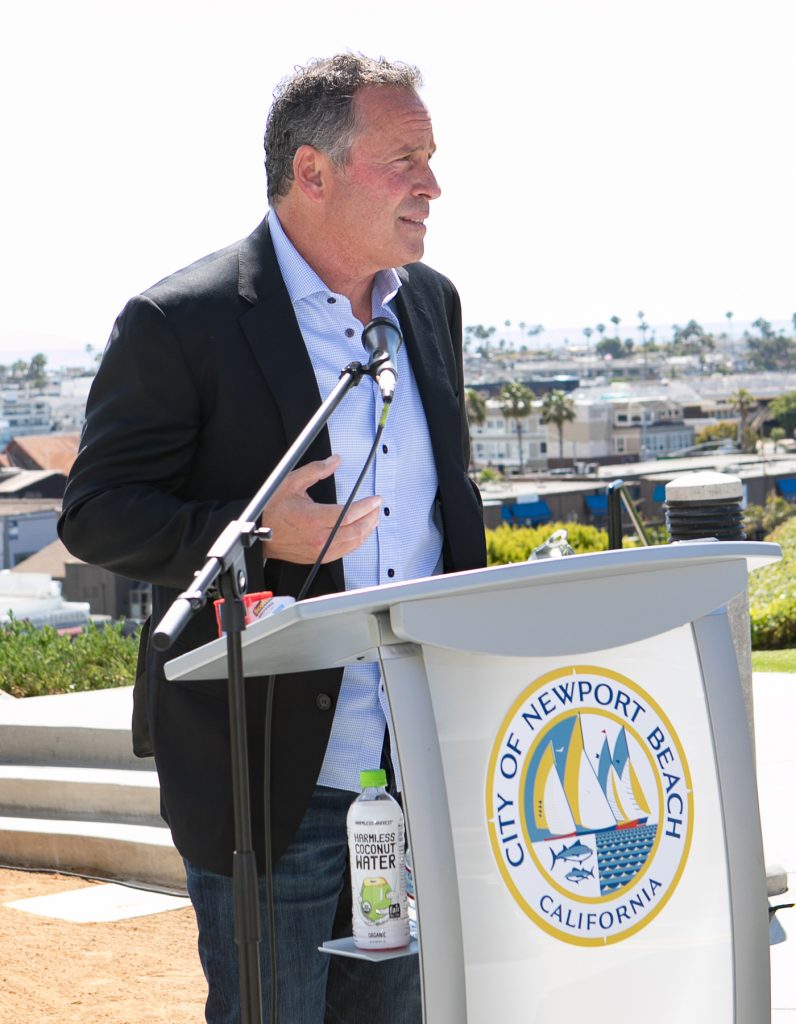 Ethan Wayne, son of John Wayne, speaks to the crowd during a ceremony to celebrate the renaming of a Newport Beach park after his father. — Photo by Jim Collins ©