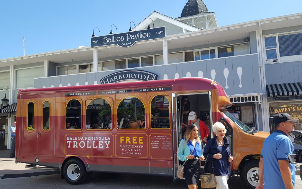 Passengers disembark from the Balboa Peninsula Trolley